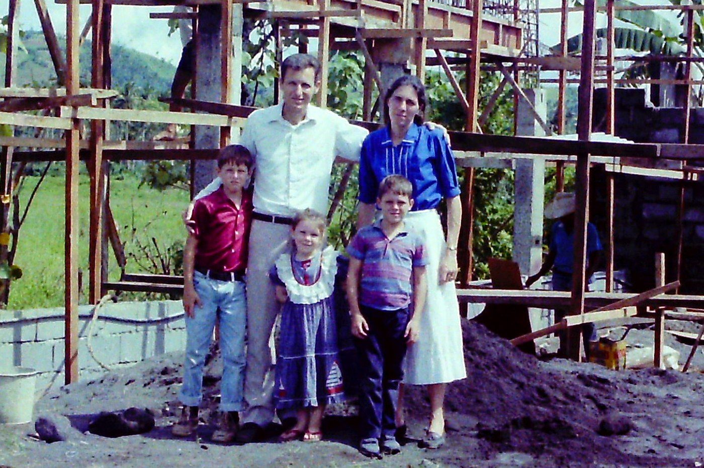 My parents, my brothers, and me on a building site in the Philippines, 1989–1990.