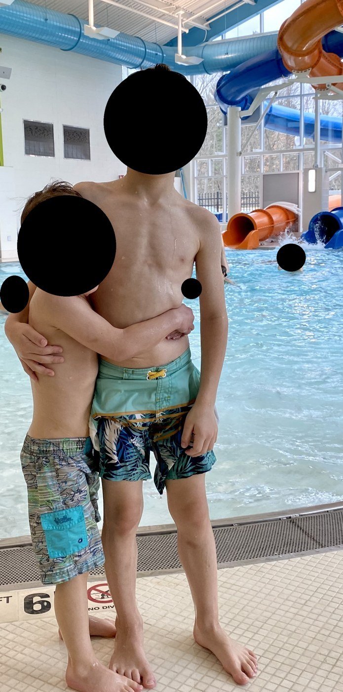 My boys at an indoor pool, April 9, 2022, in a photo sent to my phone while I was in Utah.